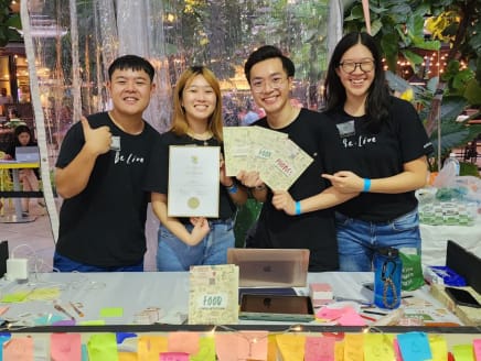 From left: Heart.th's founders Samuel Law, Jasmine Lum, Raymus Koh and Nicole Soh holding their activity booklets at the Singapore Kindness Movement's Kindness Day SG at Paya Lebar Quarter mall on May 20, 2023.