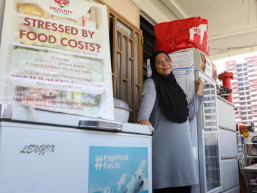 Ms Marlina Yased pictured outside her flat. She runs a community fridge initiative from her home in Lengkok Bahru near the Redhill estate.